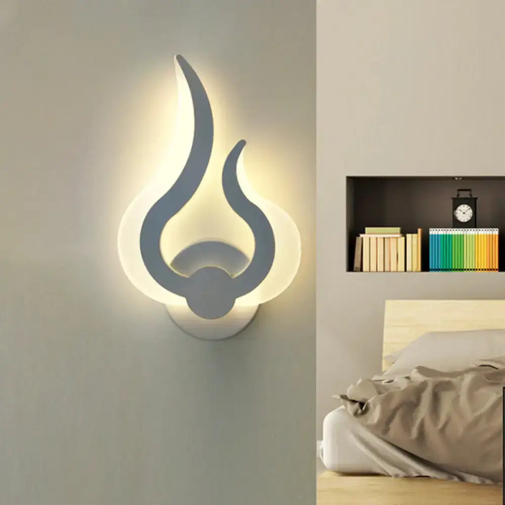 White acrylic flame sconce wall-mounted by Decorbites with warm backlit glow on Tampa Home & Garden Store