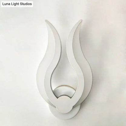 White acrylic flame sconce by Decorbites, wall-mounted sculptural flame with layered curves on Tampa Home & Garden Store