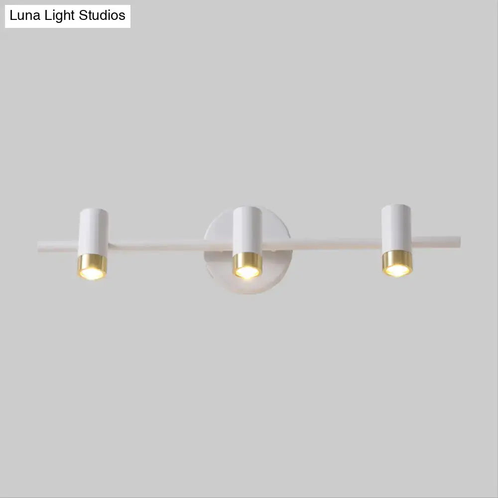 Gold 3-Arm Vanity Lamp with white cylindrical heads and gold accents by Decorbites on Tampa Home & Garden Store