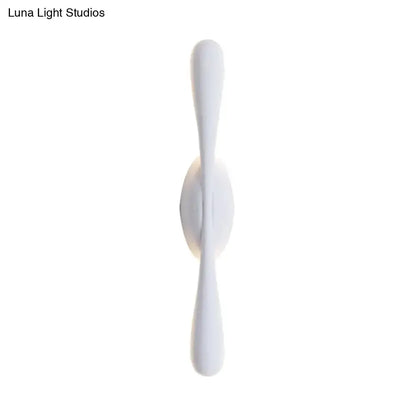 Decorbites white minimalist linear wall sconce with twin tapered ends on Tampa Home & Garden Store