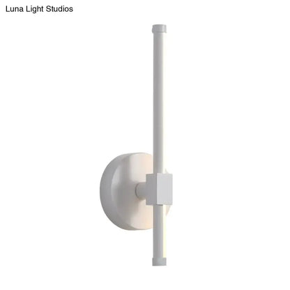 Minimalist white metal LED wall sconce with vertical bar and round backplate Decorbites on Tampa Home & Garden Store