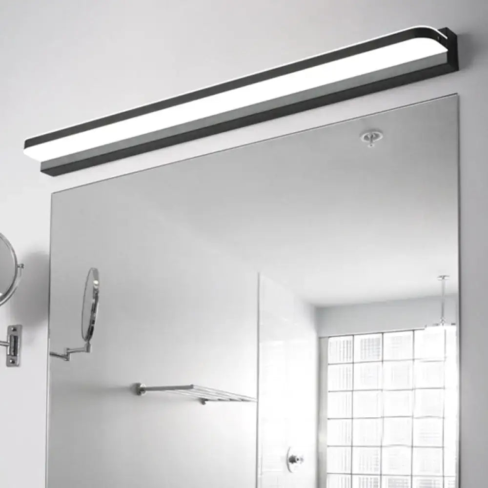 White stainless LED wall light by Decorbites with black end caps above a bathroom mirror on Tampa Home & Garden Store