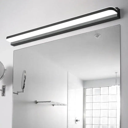 White stainless LED wall light by Decorbites with black end caps above a bathroom mirror on Tampa Home & Garden Store