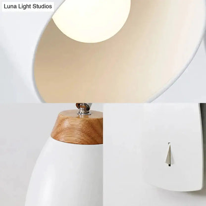 Minimalist white tapered wall light with wood accents by Decorbites, wall switch visible on Tampa Home & Garden Store
