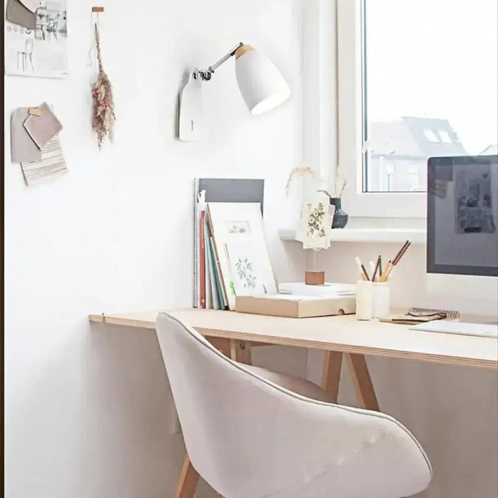 Minimalist white tapered wall light with wood accents Decorbites, mounted above a study desk on Tampa Home & Garden Store