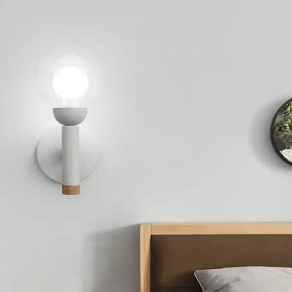 White wood armed wall lamp with cylindrical arm and natural wood accent base by Decorbites on Tampa Home & Garden Store