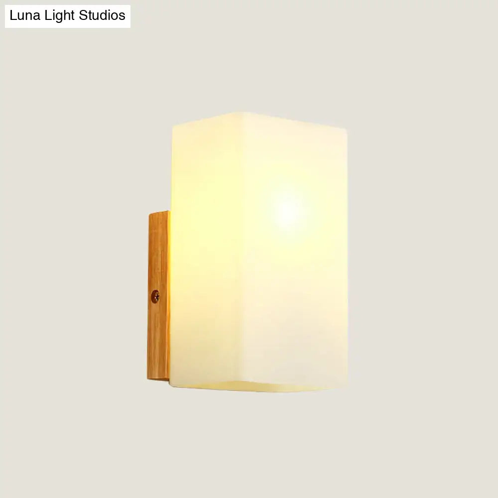 Opal glass wall sconce with wood backplate by Decorbites on Tampa Home & Garden Store