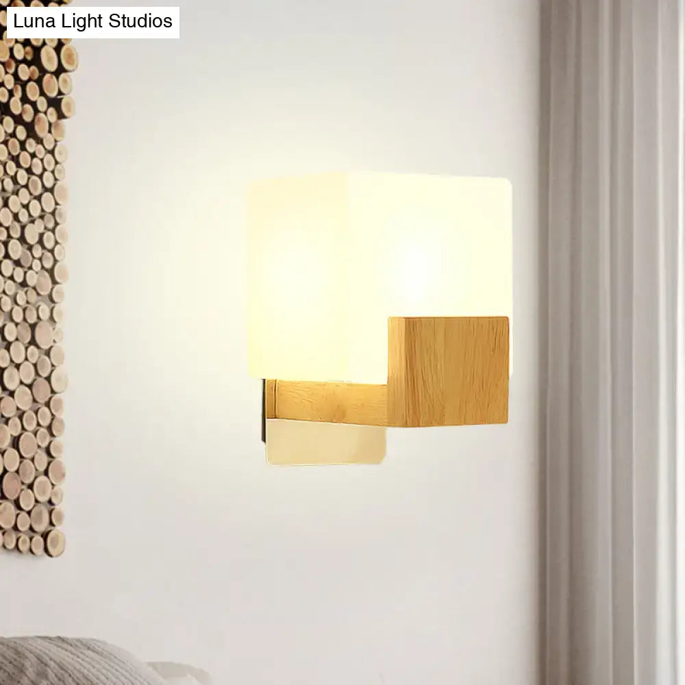 Opal Glass Wall Sconce with warm oak wood arm and opal glass shade on wall mount on Tampa Home & Garden Store
