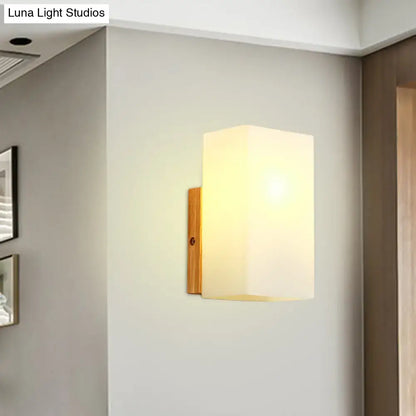 Opal Glass Wall Sconce by Decorbites, wall-mounted with warm white shade and wood backplate on Tampa Home & Garden Store