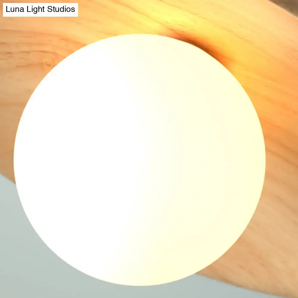 Wood semi-flush ceiling light with white globe shade by Decorbites on wood background on Tampa Home & Garden Store