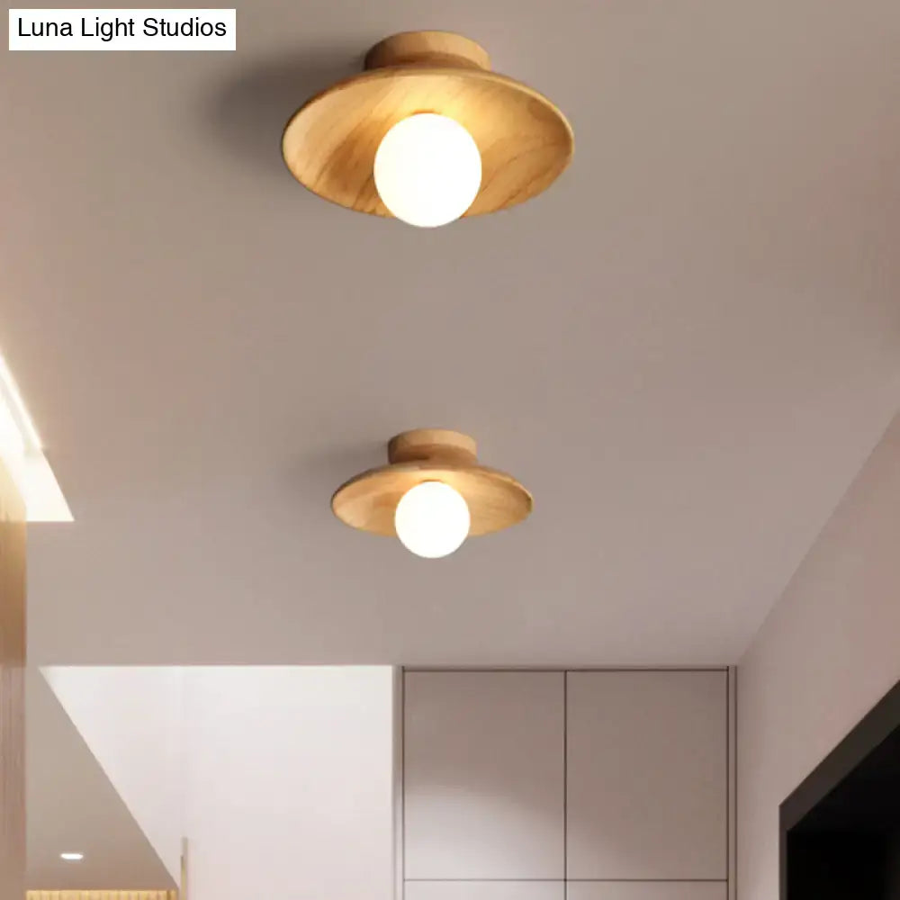 Two wood semi-flush ceiling lights by Decorbites with canopies and white glass globes on Tampa Home & Garden Store