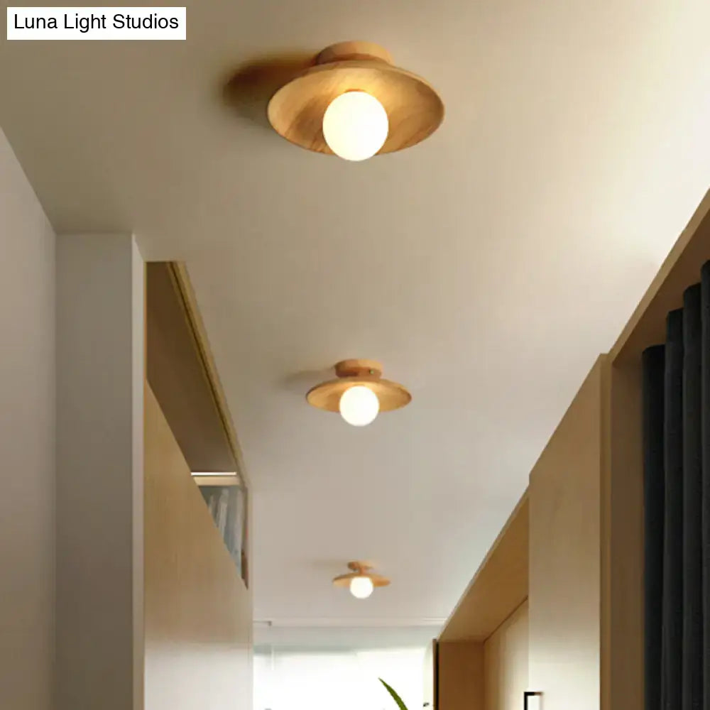 Wood semi-flush ceiling light with natural wood disc shade and white globe bulb on Tampa Home & Garden Store