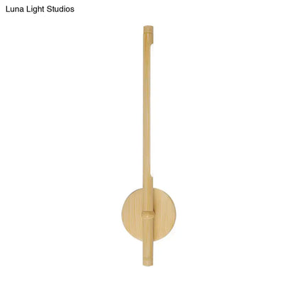 Yellow bamboo wall sconce with dimmable LED, vertical bamboo rod mounted on round base on Tampa Home & Garden Store