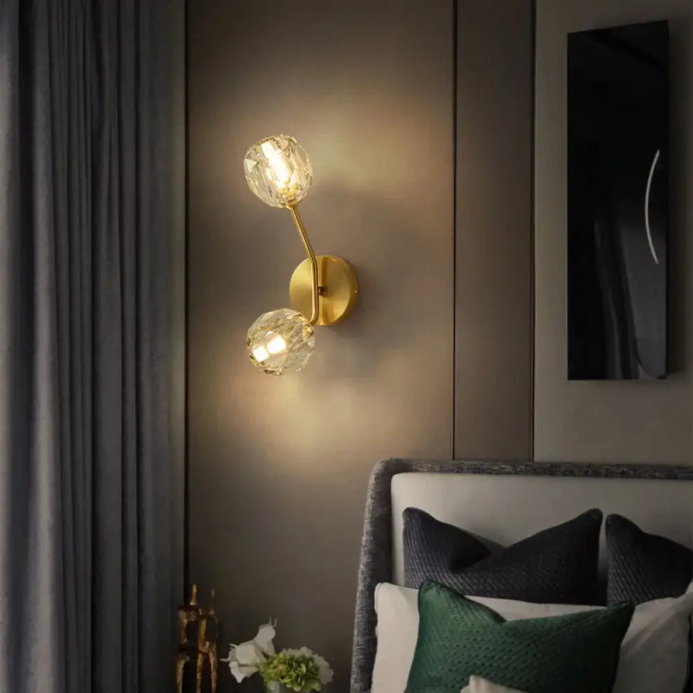 Brass branch sconce with two crystal globe lights, wall-mounted decorative lighting on Tampa Home & Garden Store