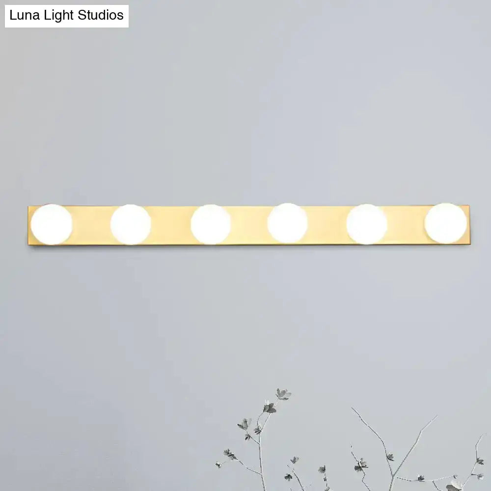 Minimalistic white 4-light vanity fixture by Decorbites with five open bulbs on brass bar on Tampa Home & Garden Store