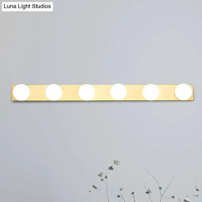 Minimalistic white 4-light vanity fixture by Decorbites with five open bulbs on brass bar on Tampa Home & Garden Store
