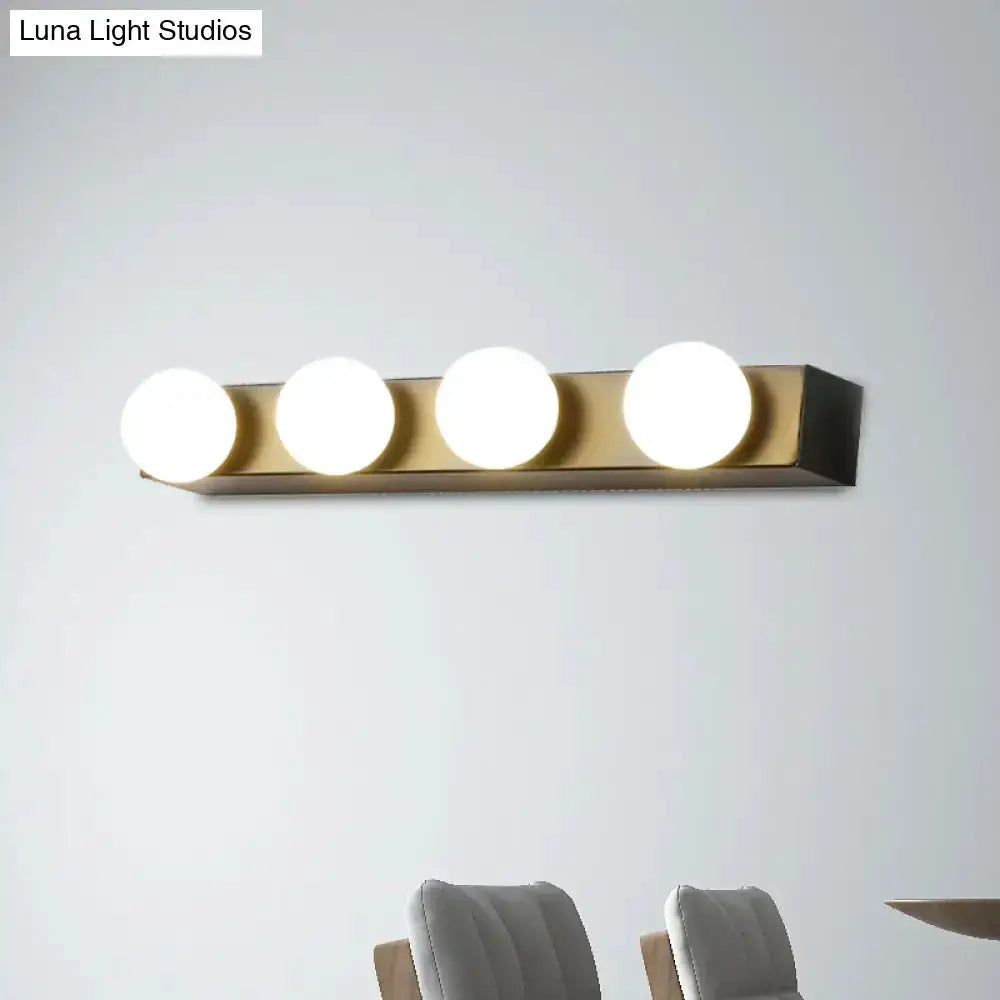 Minimalist white 4-light vanity fixture with globe bulbs on brass bar Decorbites on Tampa Home & Garden Store