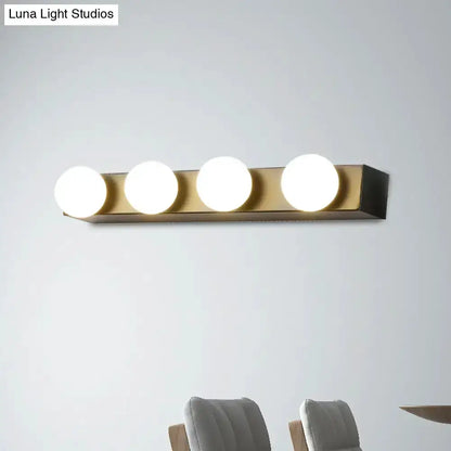Minimalist white 4-light vanity fixture with globe bulbs on brass bar Decorbites on Tampa Home & Garden Store