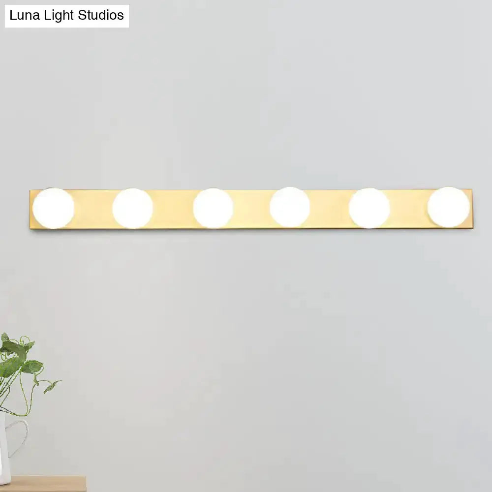 Six-light vanity light bar in brass finish with open bulbs by Luna Light Studios on Tampa Home & Garden Store