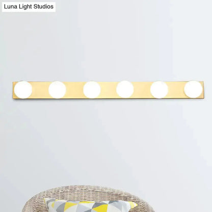 Decorbites 4-light vanity fixture with white open bulbs on gold bar bathroom lighting on Tampa Home & Garden Store