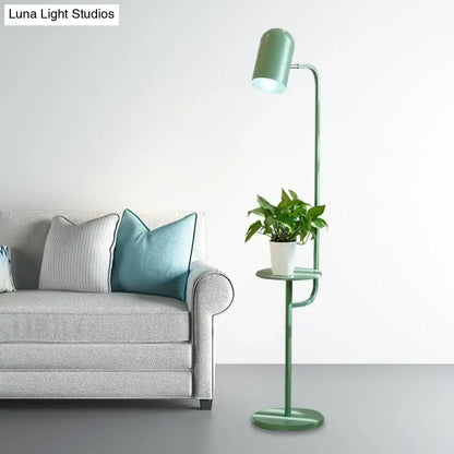 Mint Bell Metal Floor Lamp with built-in shelf and potted plant beside a sofa on Tampa Home & Garden Store