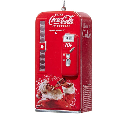 Máquina expendedora vintage de Coca-Cola con adorno de Papá Noel