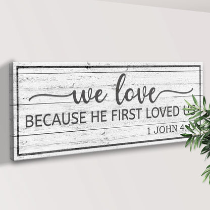 Canvas sign with whitewashed wood texture and black script 1 John 4:19 by Tailored Canvases on Tampa Home & Garden Store