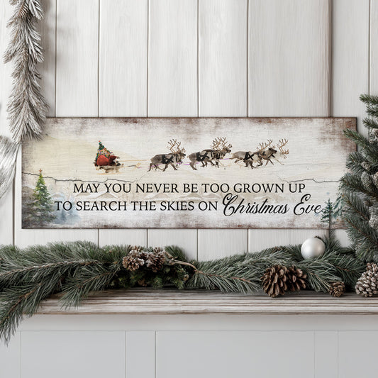 Canvas sign by Tailored Canvases with Christmas Eve quote on rustic backdrop with garland on Tampa Home & Garden Store