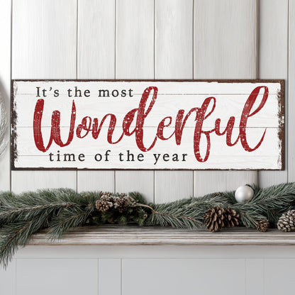Canvas sign with white background and red script reading It's the most wonderful time of the year on Tampa Home & Garden Store