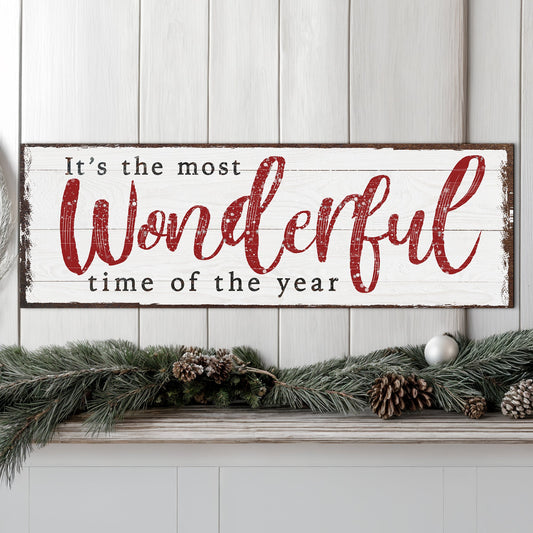 Canvas sign with white background and red script reading It's the most wonderful time of the year on Tampa Home & Garden Store