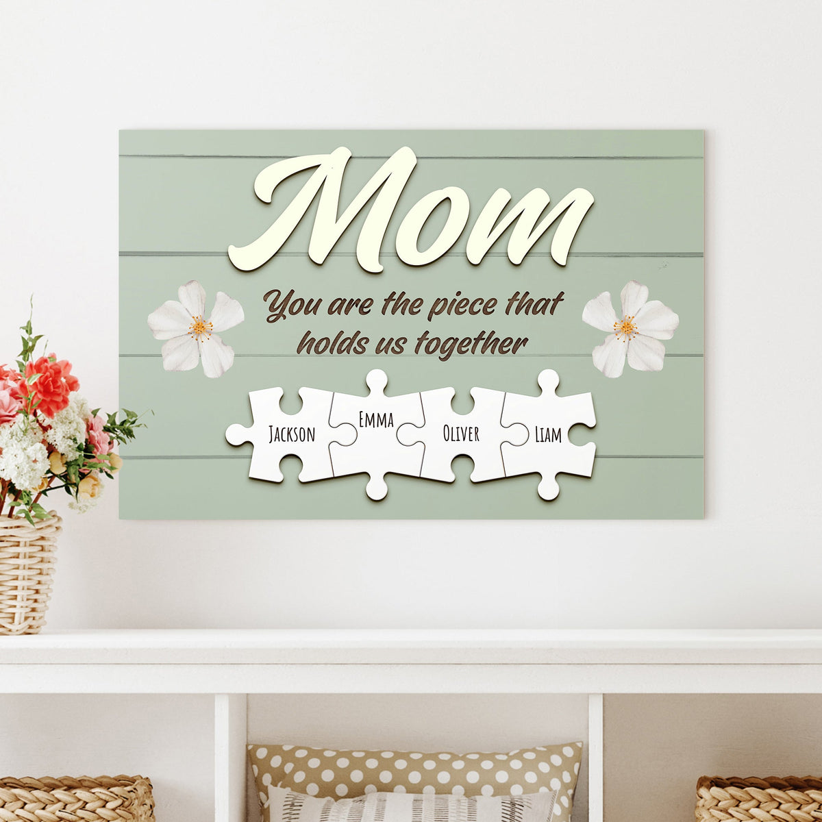 Mother's Day sign canvas with large cream Mom script on a soft green plank background with floral accents on Tampa Home & Garden Store