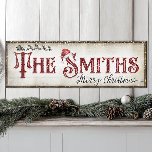 Christmas Family Name Sign IV canvas with red lettering and Santa hat on rustic frame on Tampa Home & Garden Store