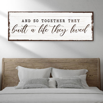 Canvas sign with whitewashed wood and frame displaying And So They Built A Life They Loved on Tampa Home & Garden Store