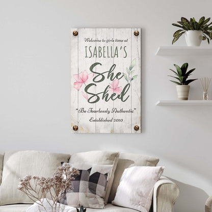 She Shed Sign IV canvas on rustic whitewashed wood with green lettering and pink flowers on Tampa Home & Garden Store