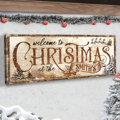 Family Welcome To Christmas Sign canvas with rustic wood frame and snow-dusted pine scene on Tampa Home & Garden Store