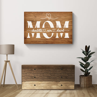 Mother's Day wood sign with large white MOM letters and cursive names Tailored Canvases on Tampa Home & Garden Store