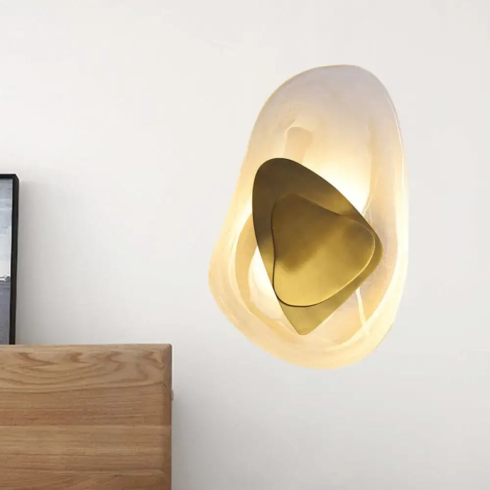 Clear Glass Rock Sconce by Decorbites with gold nested metal accents, warm illumination on Tampa Home & Garden Store