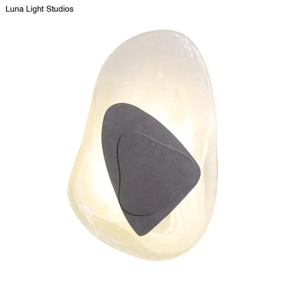 Clear glass rock sconce with a dark triangular inner accent Decorbites on Tampa Home & Garden Store