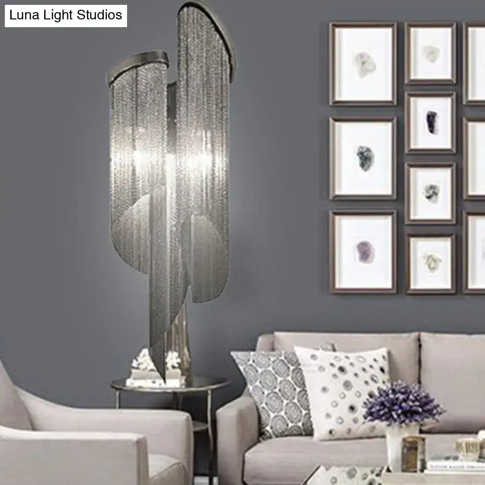 Silver tassel wall light by Decorbites with cascading metallic strands on Tampa Home & Garden Store