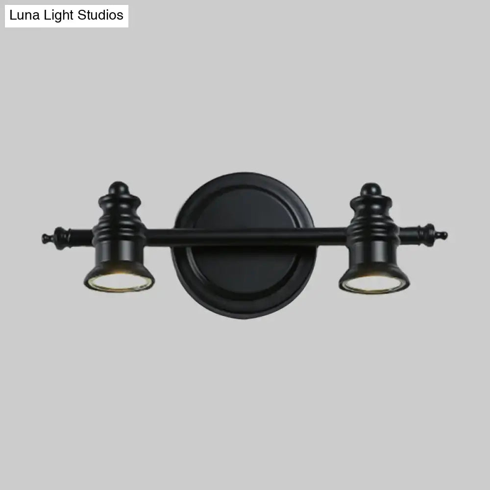 Matte black wall light by Decorbites with dual lamp heads on a circular backplate on Tampa Home & Garden Store
