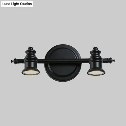 Matte black wall light by Decorbites with dual lamp heads on a circular backplate on Tampa Home & Garden Store