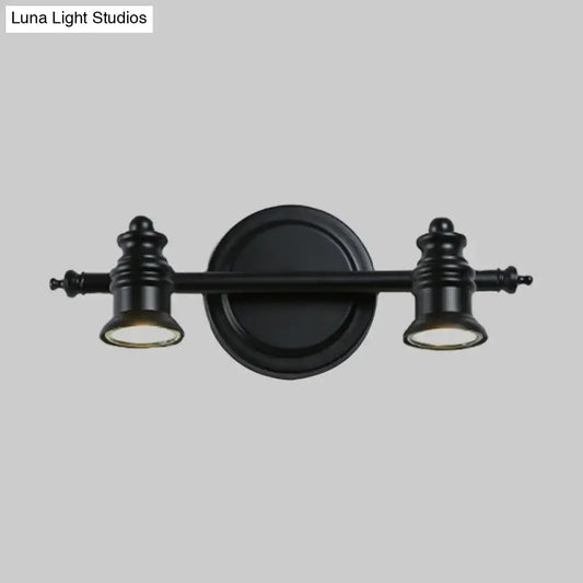 Matte black wall light by Decorbites with dual lamp heads on a circular backplate on Tampa Home & Garden Store