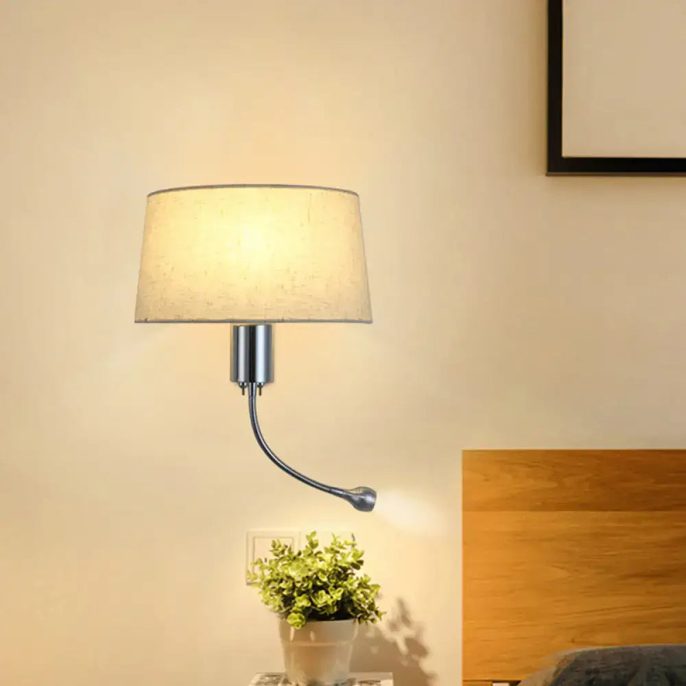 Beige flush wall sconce with fabric shade and curved black metal arm, bedroom lighting on Tampa Home & Garden Store