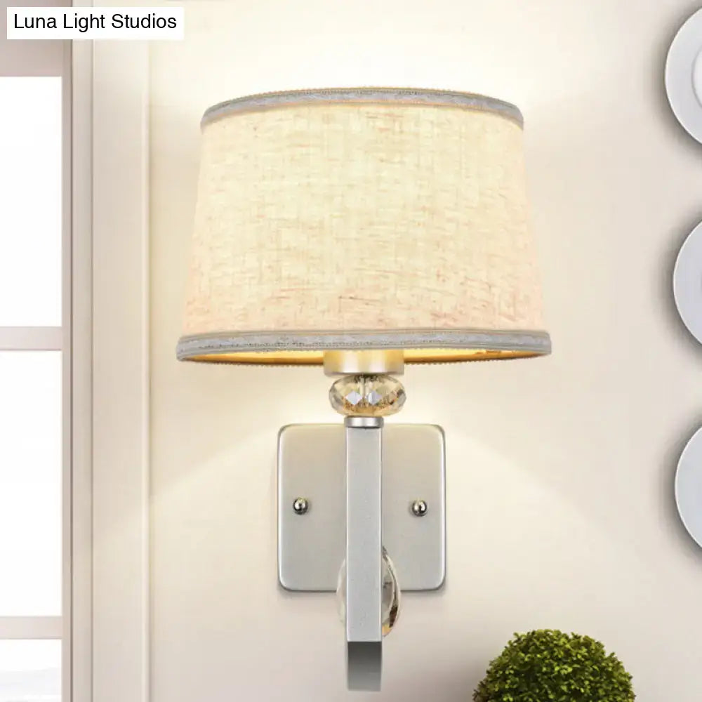 Beige fabric shade wall sconce with crystal accent on silver backplate Decorbites on Tampa Home & Garden Store