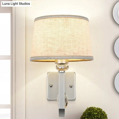 Beige fabric shade wall sconce with crystal accent on silver backplate Decorbites on Tampa Home & Garden Store