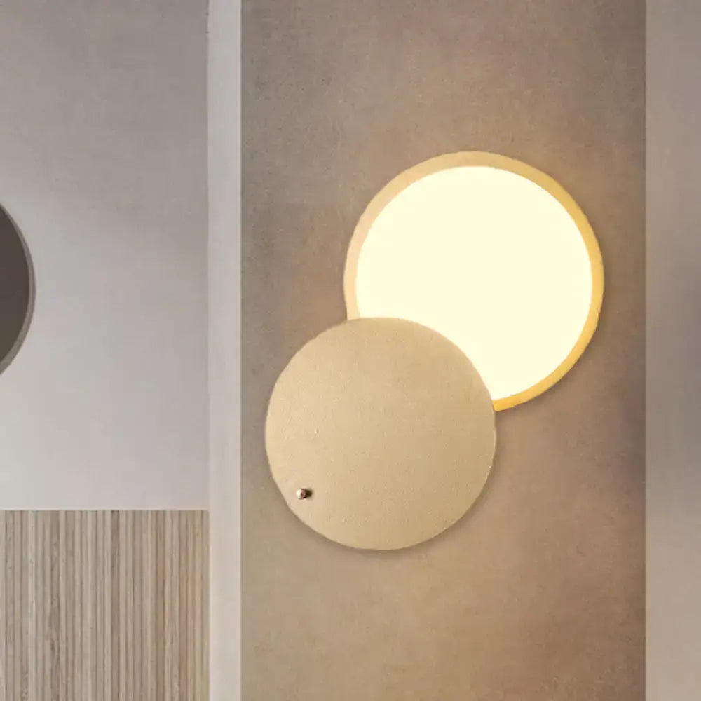 Gold metal wall lamp by Decorbites featuring overlapping circular disks and a lit round panel on Tampa Home & Garden Store