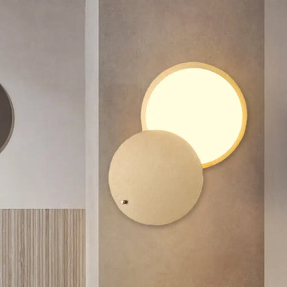 Gold metal wall lamp by Decorbites featuring overlapping circular disks and a lit round panel on Tampa Home & Garden Store