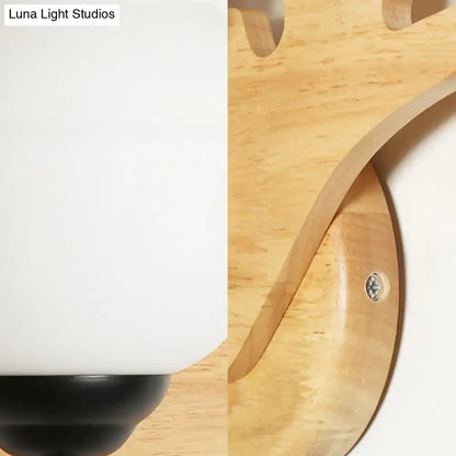 Wood Deer Head Wall Sconce natural wood round backplate with white shade visible by Decorbites on Tampa Home & Garden Store