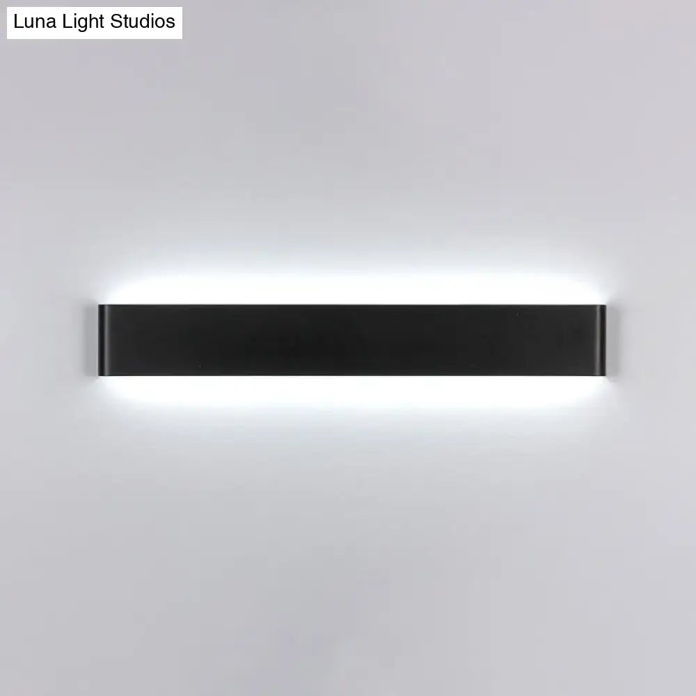 Decorbites black LED vanity sconce, matte black metal with soft white halo glow on Tampa Home & Garden Store