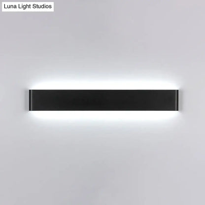 Decorbites black LED vanity sconce, matte black metal with soft white halo glow on Tampa Home & Garden Store